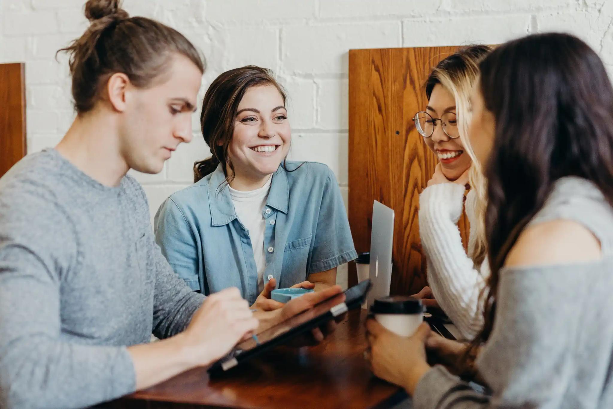 Group of friends working together at a table