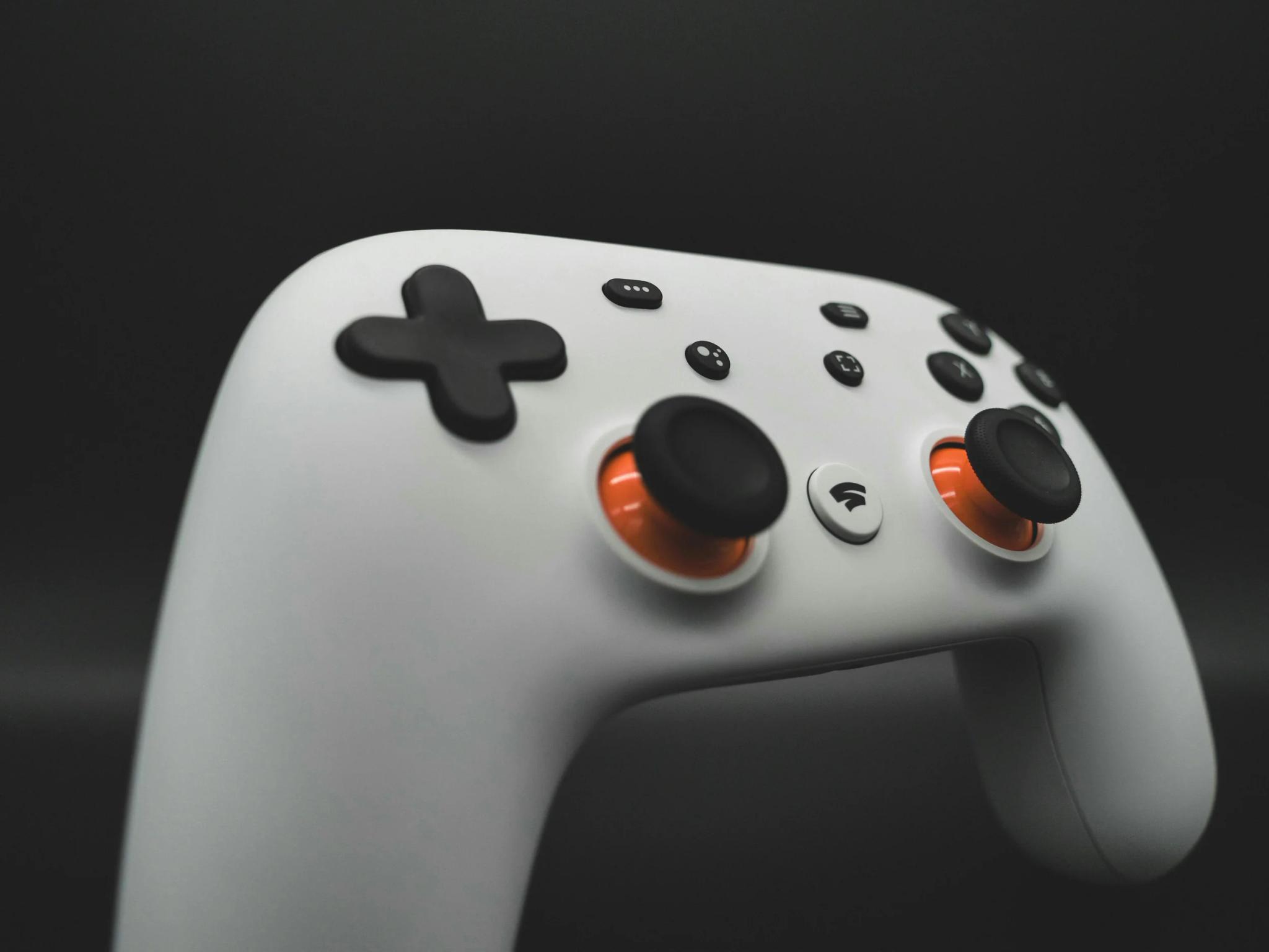 White video game controller with black background