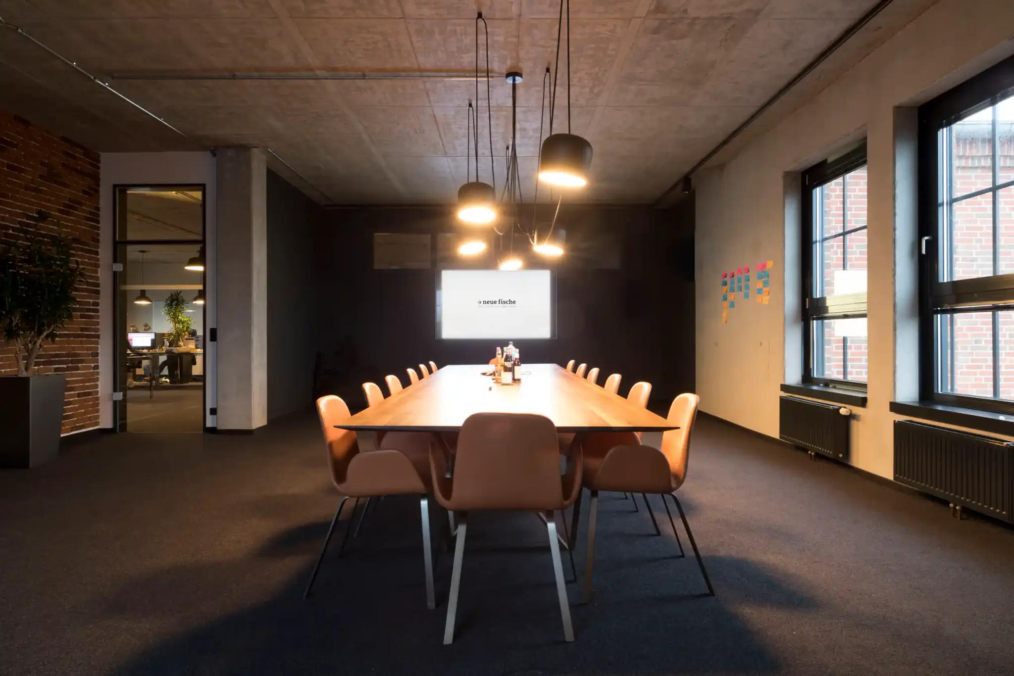 Modern conference room with large table and chairs