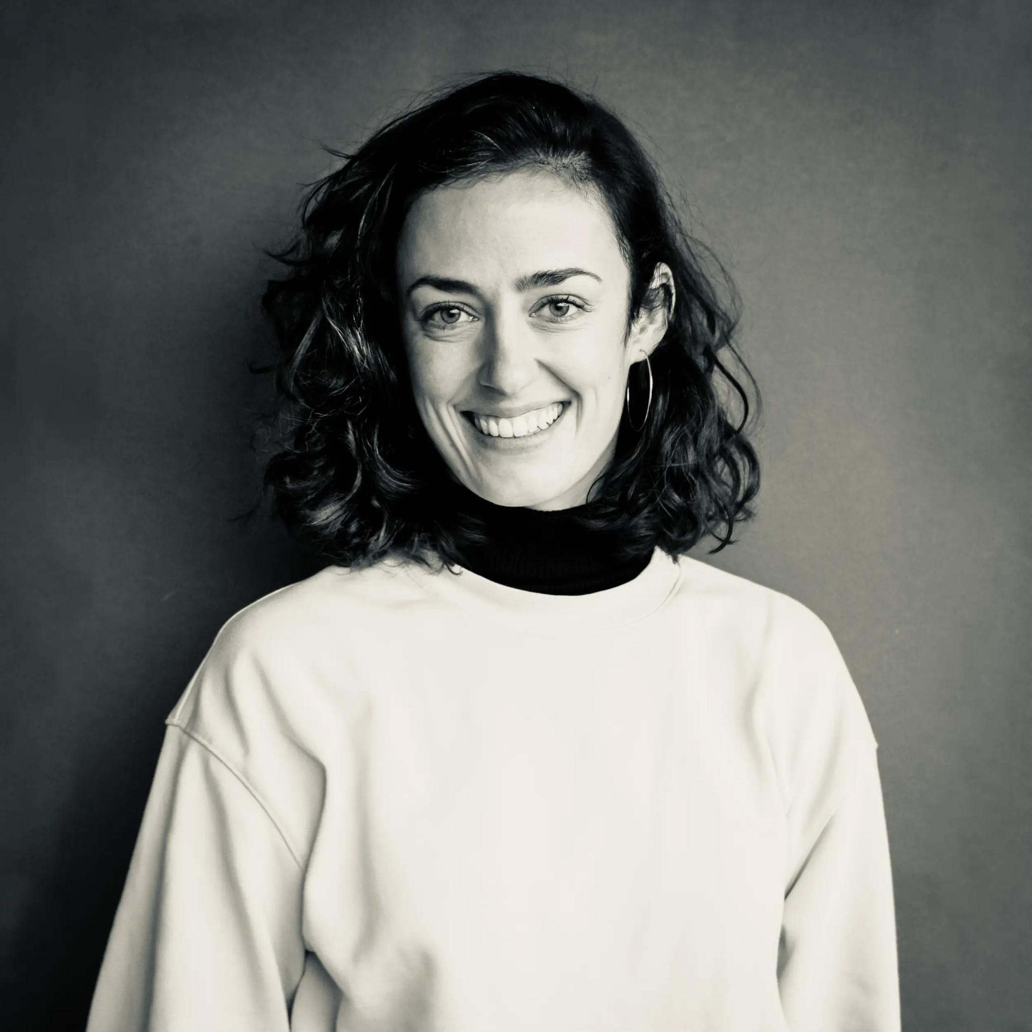 Portrait of a smiling woman in black and white