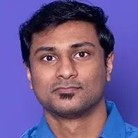 Portrait of a man against a blue background