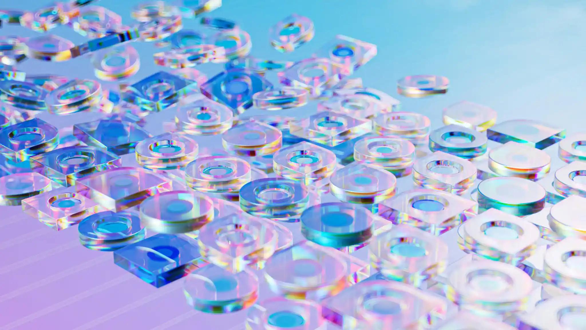 Transparent colorful glass shapes on a surface